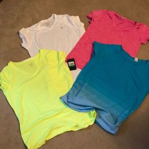 Lot of women’s workout shirts. One new with tags!!